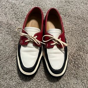 Bally boating shoes in red, white, and blue. They are a size 10